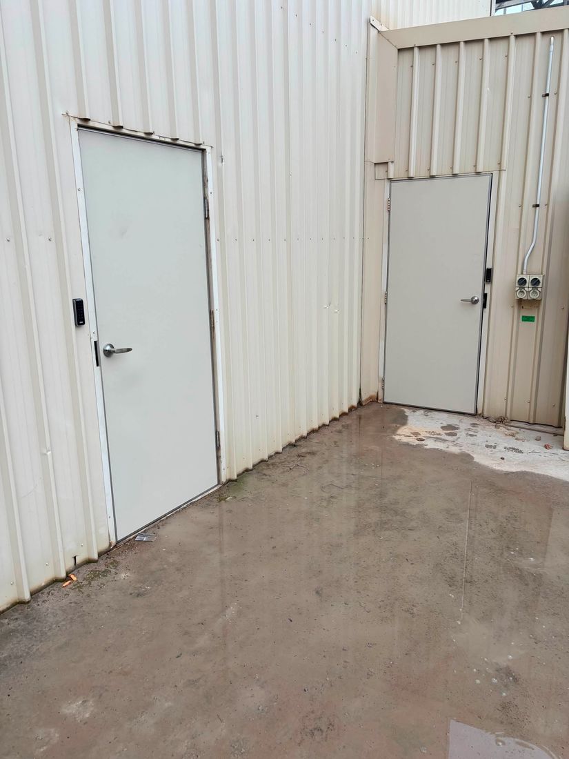 Commercial access control installed across multiple doors at a manufacturing facility